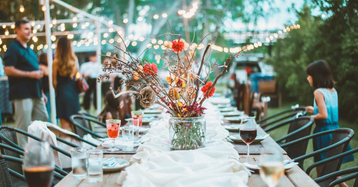 a table is ready for a large crowd outside