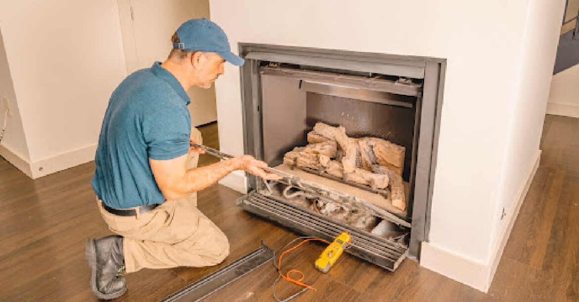 Man fixing gas fireplace